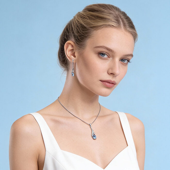 Kullast kõrvarõngad ja ripats topaasi ja teemantiga Komplekt: "Igikeltsa pisar"